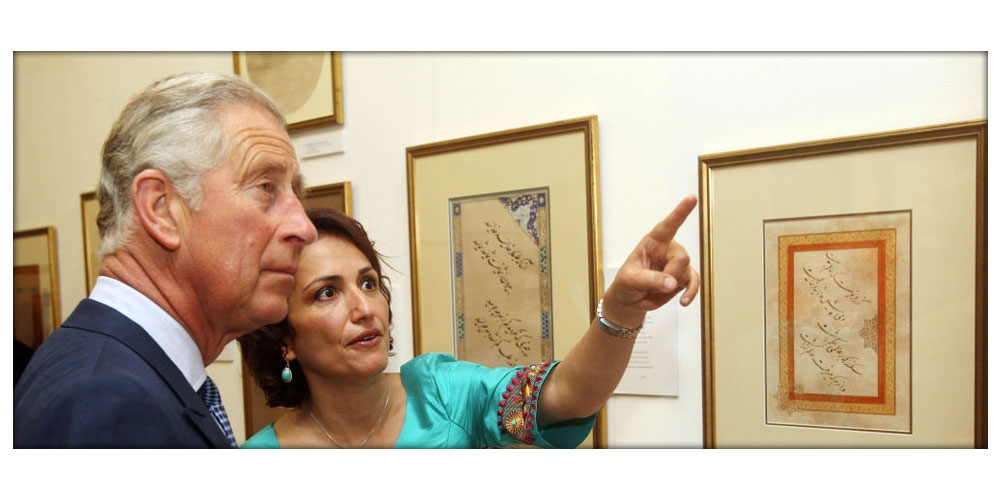The Prince of Wales speaks with artist Farkhondeh Ahmadzadeh as he looks at her artwork during a visit to The Prince’s School of Traditional Arts Degree Show in London.